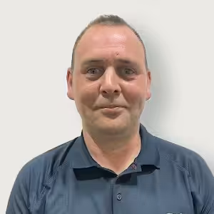 A member of staff, Phil Howard in a blue shirt