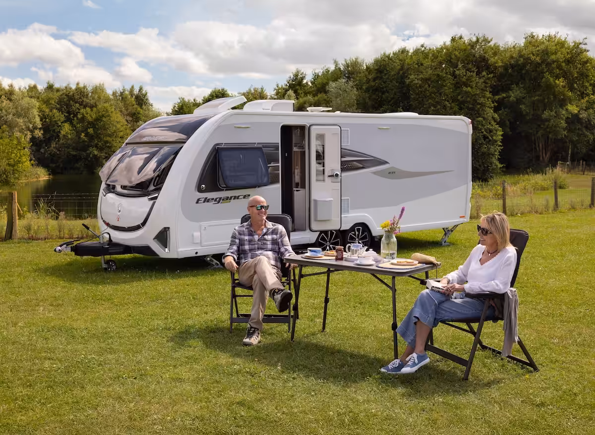 2027 Elegance Grande Couple Sat Outside